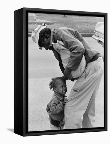African American Man Comforts Crying Child Photograph-Lantern Press-Framed Stretched Canvas