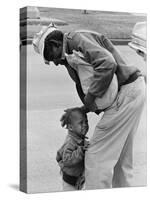 African American Man Comforts Crying Child Photograph-Lantern Press-Stretched Canvas