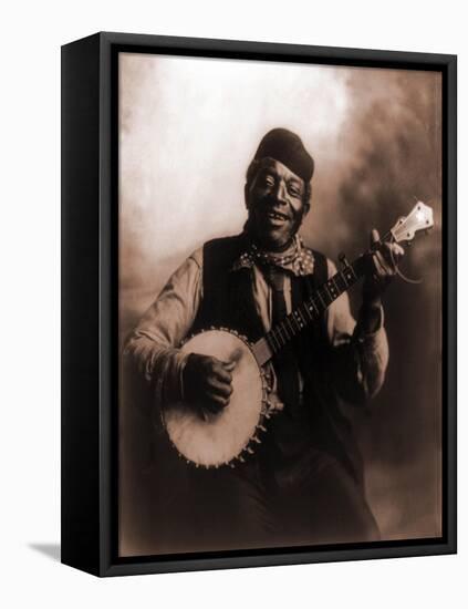 African American Man Seated and Holding Banjo, 1911-null-Framed Stretched Canvas