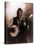 African American Man Seated and Holding Banjo, 1911-null-Stretched Canvas