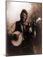 African American Man Seated and Holding Banjo, 1911-null-Mounted Photo