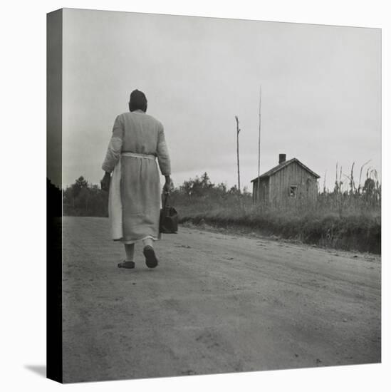 African American Midwife Carrying Her Medical Bag on a Dirt Road in Georgia-null-Stretched Canvas