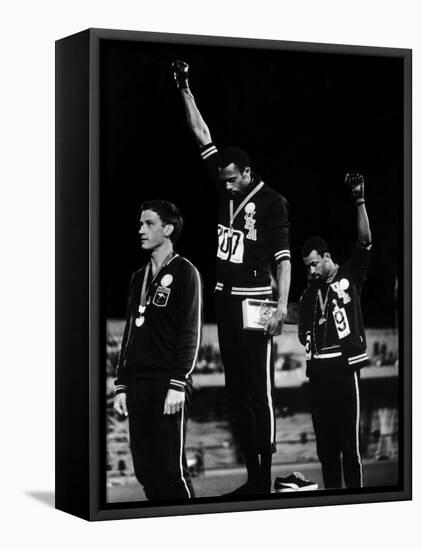 African American Track Star Tommie Smith, John Carlos After Winning Gold and Bronze Olympic Medal-John Dominis-Framed Stretched Canvas