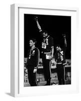 African American Track Star Tommie Smith, John Carlos After Winning Gold and Bronze Olympic Medal-John Dominis-Framed Premium Photographic Print