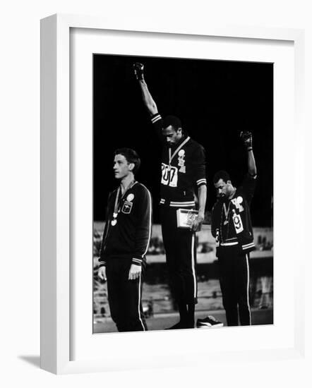 African American Track Star Tommie Smith, John Carlos After Winning Gold and Bronze Olympic Medal-John Dominis-Framed Premium Photographic Print