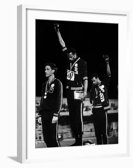 African American Track Star Tommie Smith, John Carlos After Winning Gold and Bronze Olympic Medal-John Dominis-Framed Premium Photographic Print