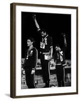 African American Track Star Tommie Smith, John Carlos After Winning Gold and Bronze Olympic Medal-John Dominis-Framed Premium Photographic Print