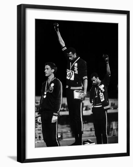 African American Track Star Tommie Smith, John Carlos After Winning Gold and Bronze Olympic Medal-John Dominis-Framed Premium Photographic Print