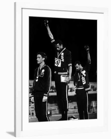 African American Track Star Tommie Smith, John Carlos After Winning Gold and Bronze Olympic Medal-John Dominis-Framed Premium Photographic Print