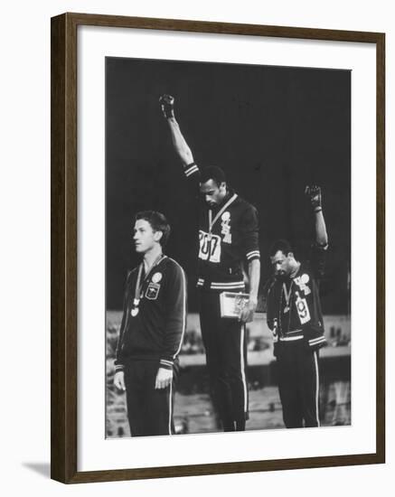 African-American Track Stars Tommie Smith and John Carlos after Winning Olympic Medals-John Dominis-Framed Premium Photographic Print