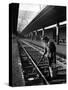 African American Woman Picking Up Debris on Tracks at Union Station-Alfred Eisenstaedt-Stretched Canvas