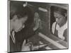 African American Women Riveters Work on the Center Section of a Bomber During World War 2-null-Mounted Art Print