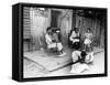 African American Women Sitting on the Porch of their Ramshackle House Watching their Children Play-Alfred Eisenstaedt-Framed Stretched Canvas