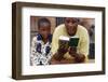 African mother reading the Koran, Lome, Togo-Godong-Framed Photographic Print