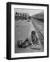 Aged Refugee Fighting Hunger, Sweeps Up Spilled Rice on the Railroad Station Platform-Jack Birns-Framed Photographic Print