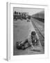 Aged Refugee Fighting Hunger, Sweeps Up Spilled Rice on the Railroad Station Platform-Jack Birns-Framed Photographic Print