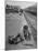 Aged Refugee Fighting Hunger, Sweeps Up Spilled Rice on the Railroad Station Platform-Jack Birns-Mounted Photographic Print