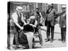 Agents pour liquor into sewer following a raid during the height of prohibition, New York, 1921-null-Stretched Canvas