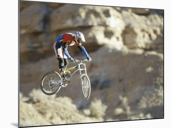 Airborne Bicyclist-null-Mounted Photographic Print