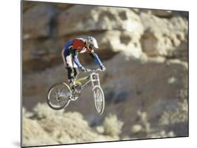 Airborne Bicyclist-null-Mounted Photographic Print