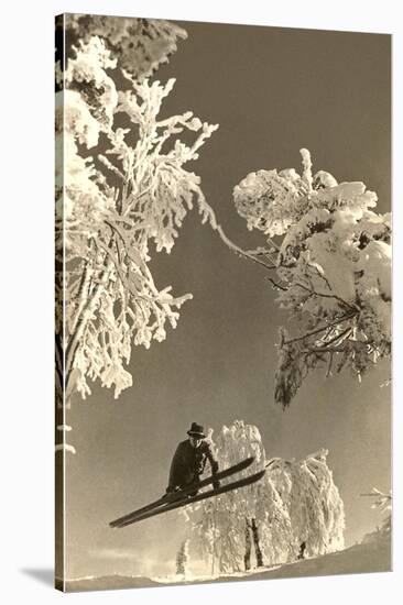 Airborne Skier Amid Frost-Laden Trees-null-Stretched Canvas