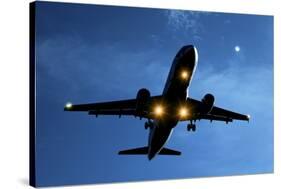 Airbus A320 Airliner Landing At Night-Detlev Van Ravenswaay-Stretched Canvas