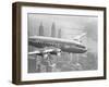 Aircraft Flying over City-null-Framed Premium Photographic Print