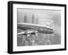 Aircraft Flying over City-null-Framed Premium Photographic Print