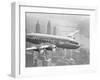 Aircraft Flying over City-null-Framed Premium Photographic Print