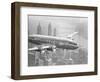 Aircraft Flying over City-null-Framed Photographic Print