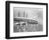 Aircraft Flying over City-null-Framed Photographic Print