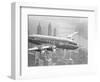 Aircraft Flying over City-null-Framed Photographic Print