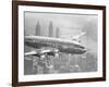 Aircraft Flying over City-null-Framed Photographic Print