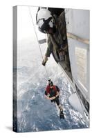 Aircrewman Assists in Hoisting a Member into an Mh-60S Sea Hawk-null-Stretched Canvas