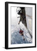 Aircrewman Assists in Hoisting a Member into an Mh-60S Sea Hawk-null-Framed Photographic Print