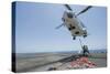 Airmen Attach a Cargo Hook to an SA-330J Puma Helicopter-null-Stretched Canvas