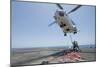 Airmen Attach a Cargo Hook to an SA-330J Puma Helicopter-null-Mounted Photographic Print