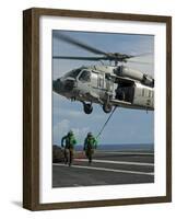 Airmen Run to Cover after Attaching Cargo Legs to an Mh-60S Sea Hawk-null-Framed Photographic Print