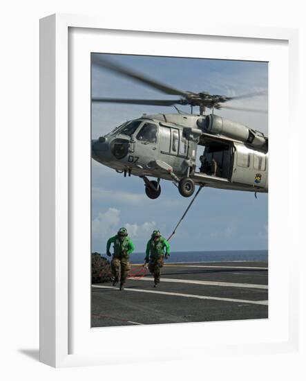 Airmen Run to Cover after Attaching Cargo Legs to an Mh-60S Sea Hawk-null-Framed Photographic Print