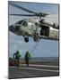 Airmen Run to Cover after Attaching Cargo Legs to an Mh-60S Sea Hawk-null-Mounted Photographic Print