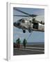 Airmen Run to Cover after Attaching Cargo Legs to an Mh-60S Sea Hawk-null-Framed Photographic Print