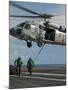 Airmen Run to Cover after Attaching Cargo Legs to an Mh-60S Sea Hawk-null-Mounted Photographic Print