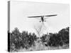 Airplane Dropping Cloud of Mosquito Insecticide-null-Stretched Canvas