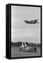 Airplane Flying over Race Car in Action-null-Framed Stretched Canvas