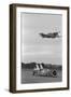 Airplane Flying over Race Car in Action-null-Framed Photographic Print