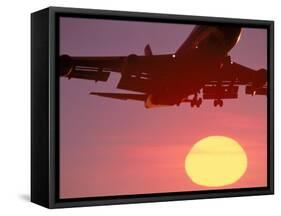 Airplane in Flight During Sunrise, Sunset-Mitch Diamond-Framed Stretched Canvas