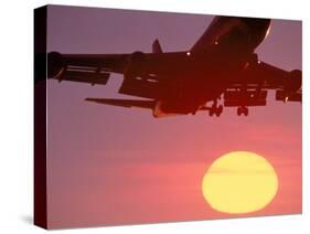 Airplane in Flight During Sunrise, Sunset-Mitch Diamond-Stretched Canvas