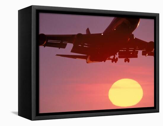 Airplane in Flight During Sunrise, Sunset-Mitch Diamond-Framed Stretched Canvas