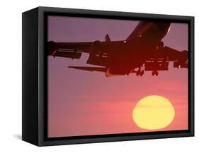 Airplane in Flight During Sunrise, Sunset-Mitch Diamond-Framed Stretched Canvas