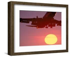 Airplane in Flight During Sunrise, Sunset-Mitch Diamond-Framed Photographic Print